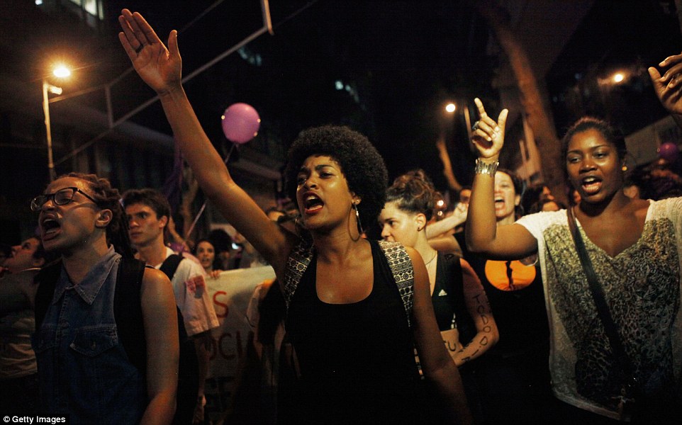 3204E6B800000578-0-RIO_DE_JANEIRO_BRAZIL_MARCH_08_Activists_and_supporters_chant_du-m-74_1457524489535